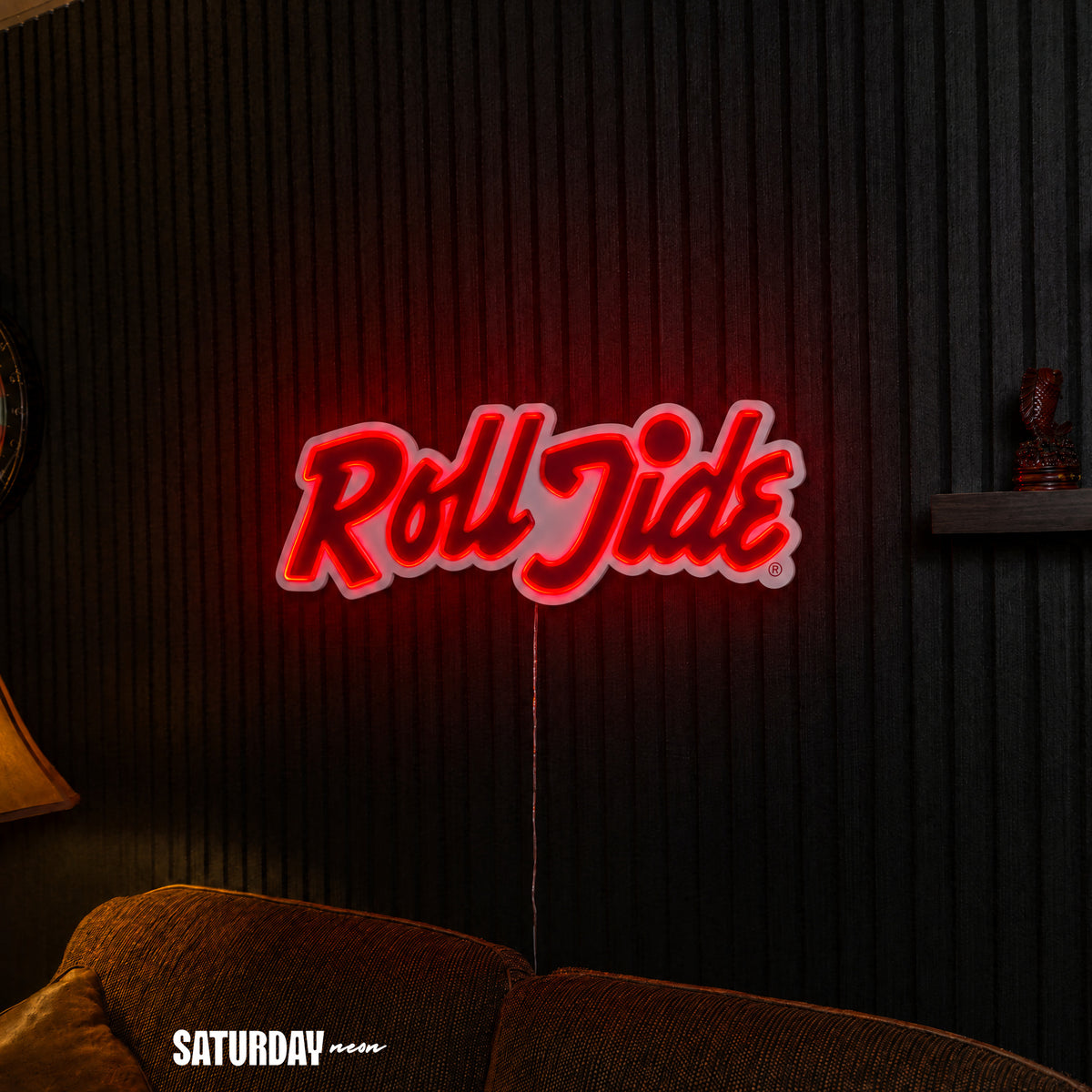 Alabama Roll Tide Script LED Neon Sign - 24" x 8.3" above a couch - Saturday Neon