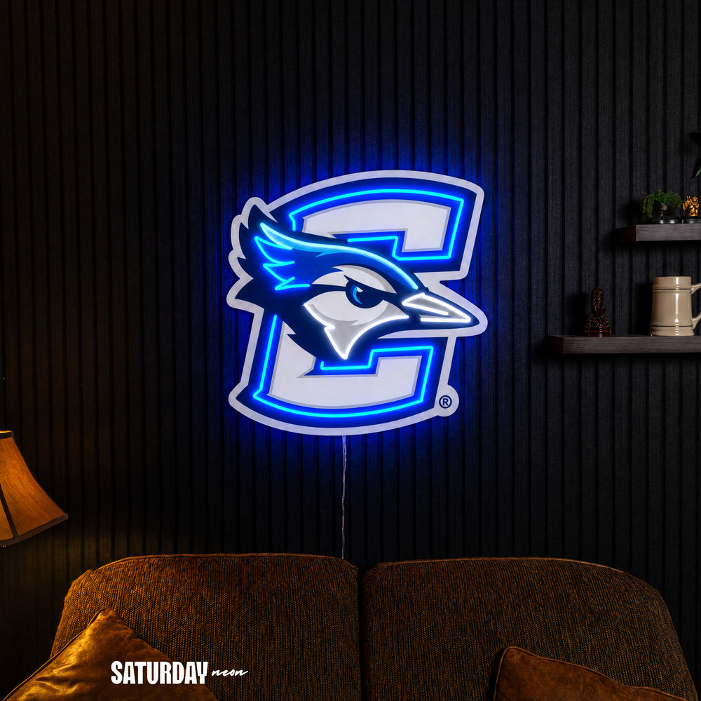 Creighton Bluejays LED Neon Sign - Plus (23.9" x 24") in a living room - Saturday Neon