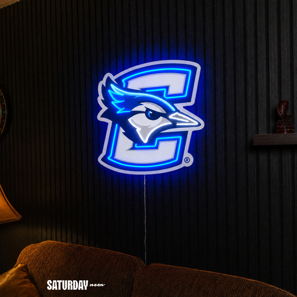 Creighton Bluejays LED Neon Sign - Max (31.86" x 32") above a couch - Saturday Neon
