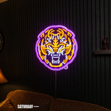 LSU Tigers Tiger Head LED Neon Sign - 24" x 24" above a couch - Saturday Neon