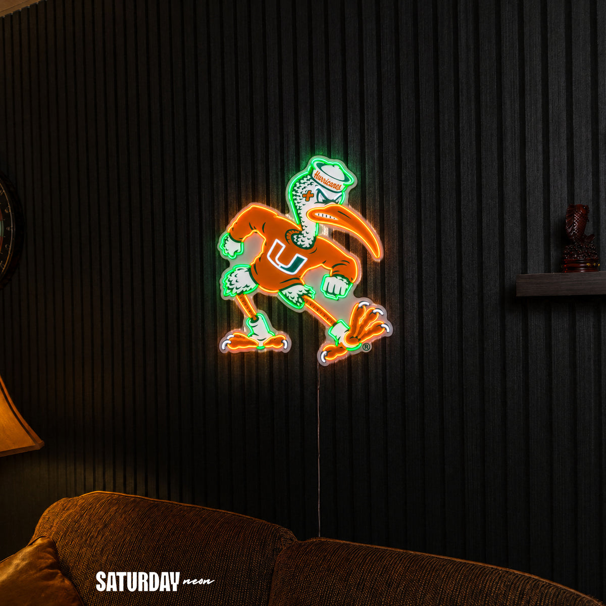 Miami Hurricanes Sebastian the Ibis Mascot LED Neon Sign - 21.49" x 24" above a couch - Saturday Neon