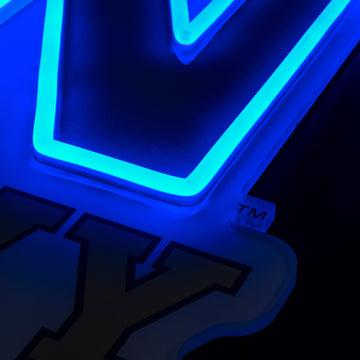 Navy Midshipmen logo LED neon sign at a side angle, lit
