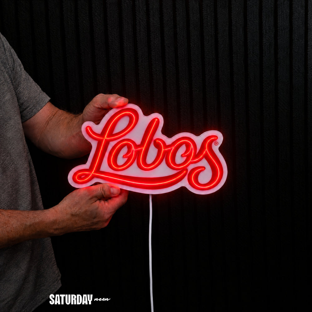 New Mexico Lobos Script LED Neon Sign - Standard (15" x 8.96") held in hand for scale - Saturday Neon