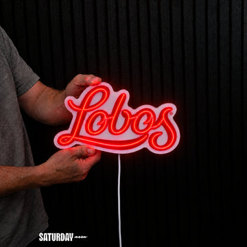New Mexico Lobos Script LED Neon Sign - Standard (15" x 8.96") held in hand for scale - Saturday Neon