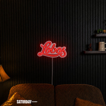 New Mexico Lobos Script LED Neon Sign - Standard (15" x 8.96") in a living room - Saturday Neon