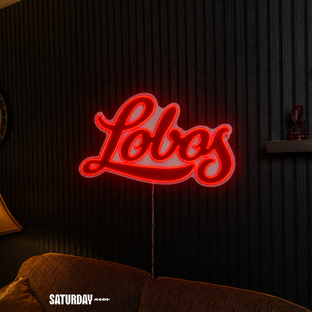 New Mexico Lobos Script LED Neon Sign - Max (32" x 18.88") above a couch - Saturday Neon