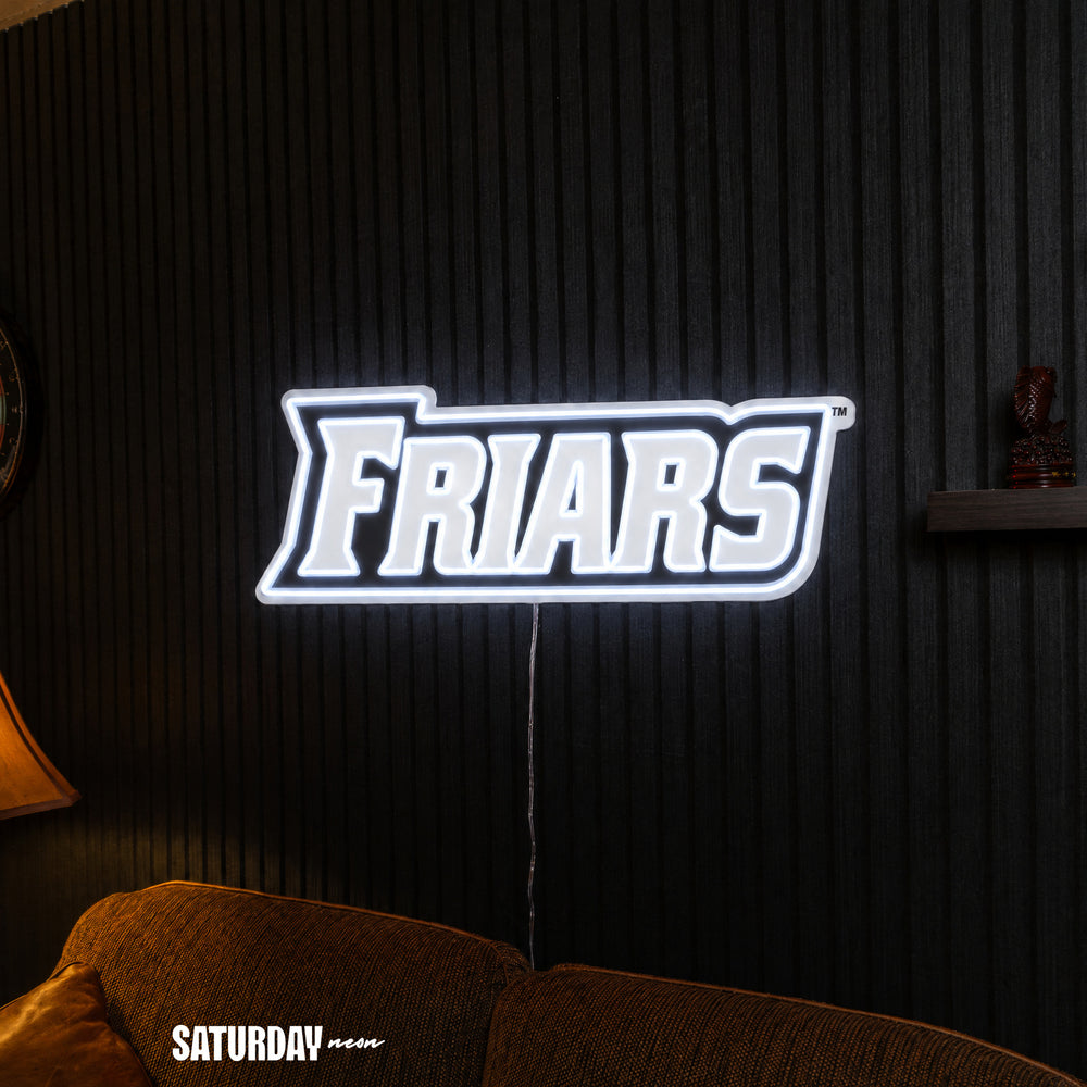 Providence Friars Wordmark LED Neon Sign - 24" x 8.37" above a couch - Saturday Neon