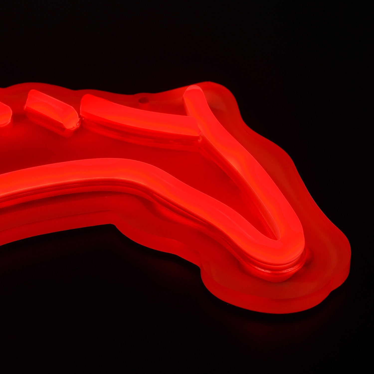 SMU Mustangs logo LED neon sign at a side angle, lit