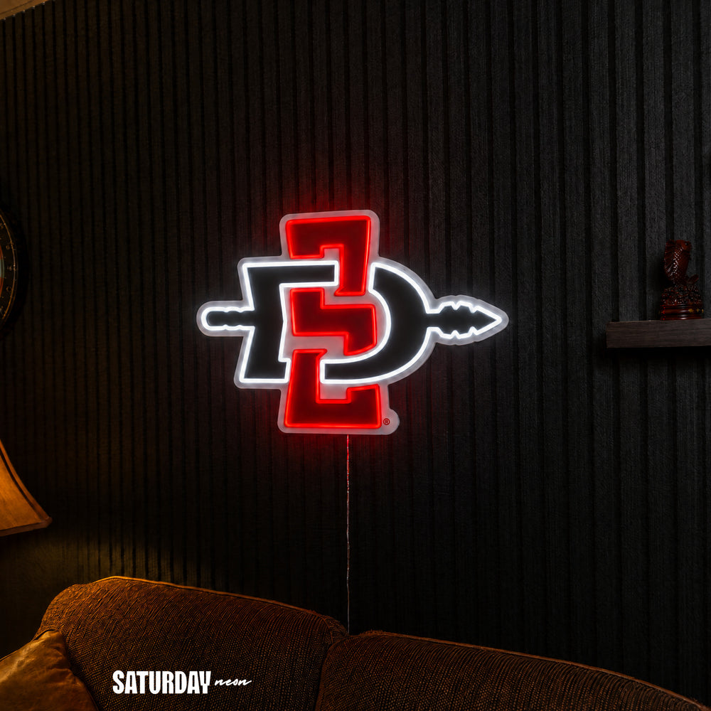 San Diego State Aztecs LED Neon Sign - Plus (24" x 16.98") above a couch - Saturday Neon