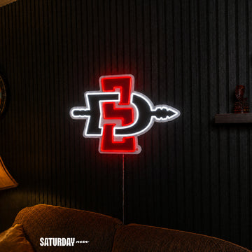 San Diego State Aztecs LED Neon Sign - Plus (24" x 16.98") above a couch - Saturday Neon