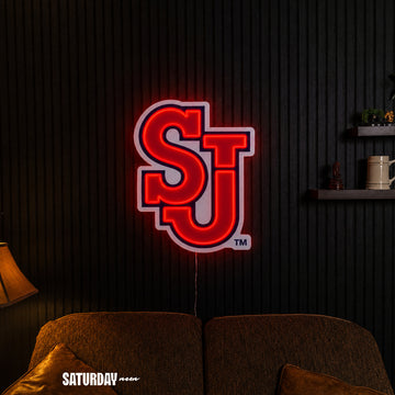 St. John's Red Storm SJ LED Neon Sign - Max (23.38" x 32") in a living room - Saturday Neon