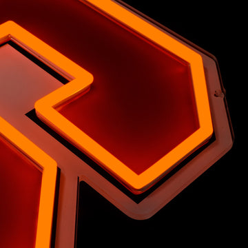 Syracuse Orange logo LED neon sign at a side angle, lit