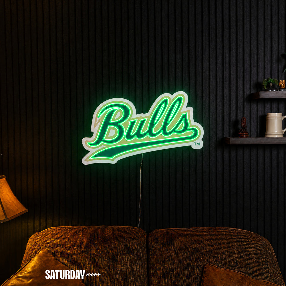 USF Bulls Script LED Neon Sign - 24" x 14.55" in a living room - Saturday Neon
